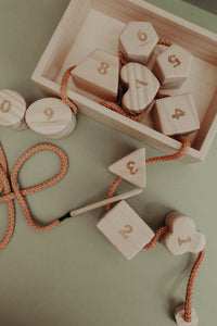 Wooden lacing toy with numbers and geometry shapes